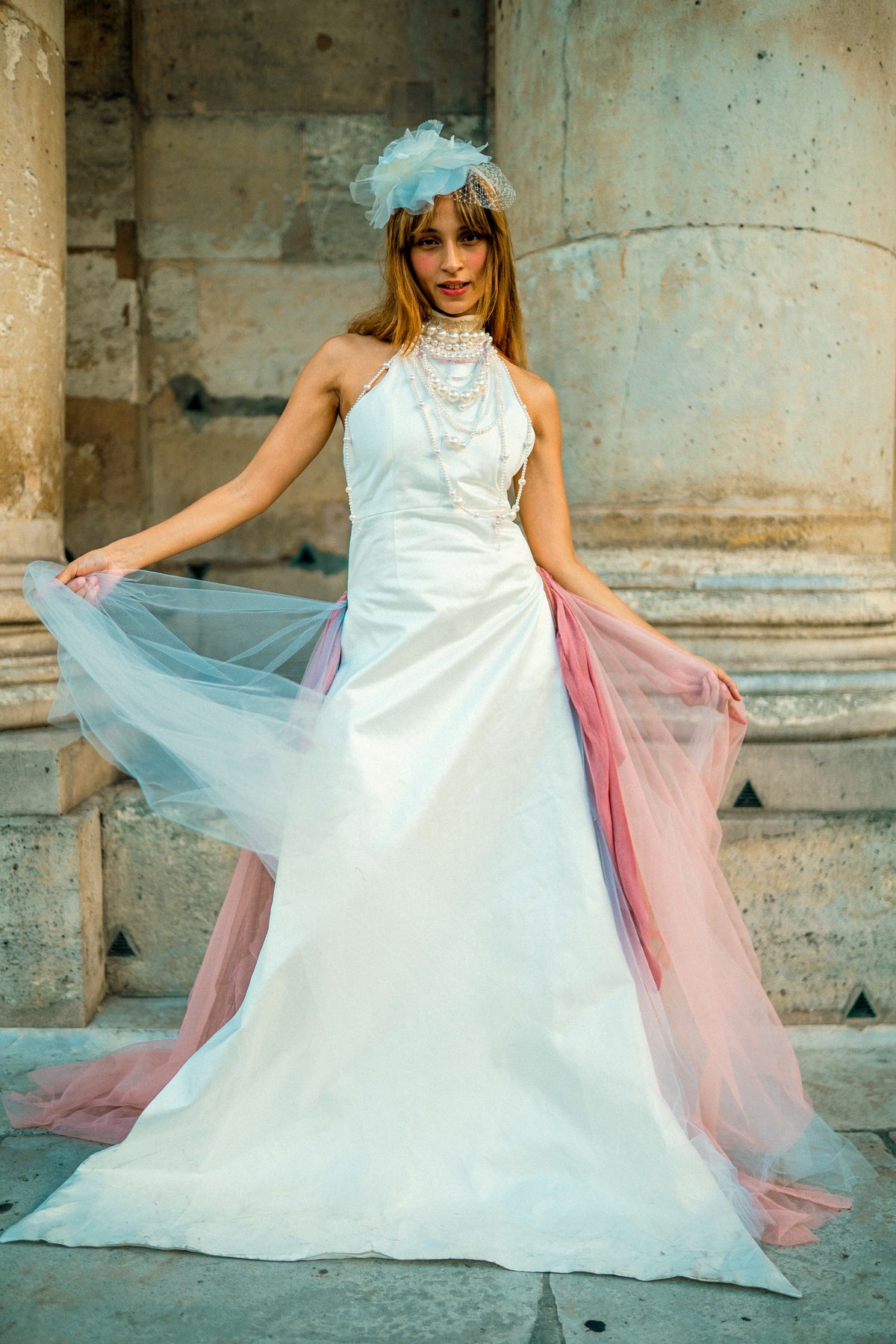 The Dalia Dress — satin bridal gown with pearl details and flowing tulle, front view